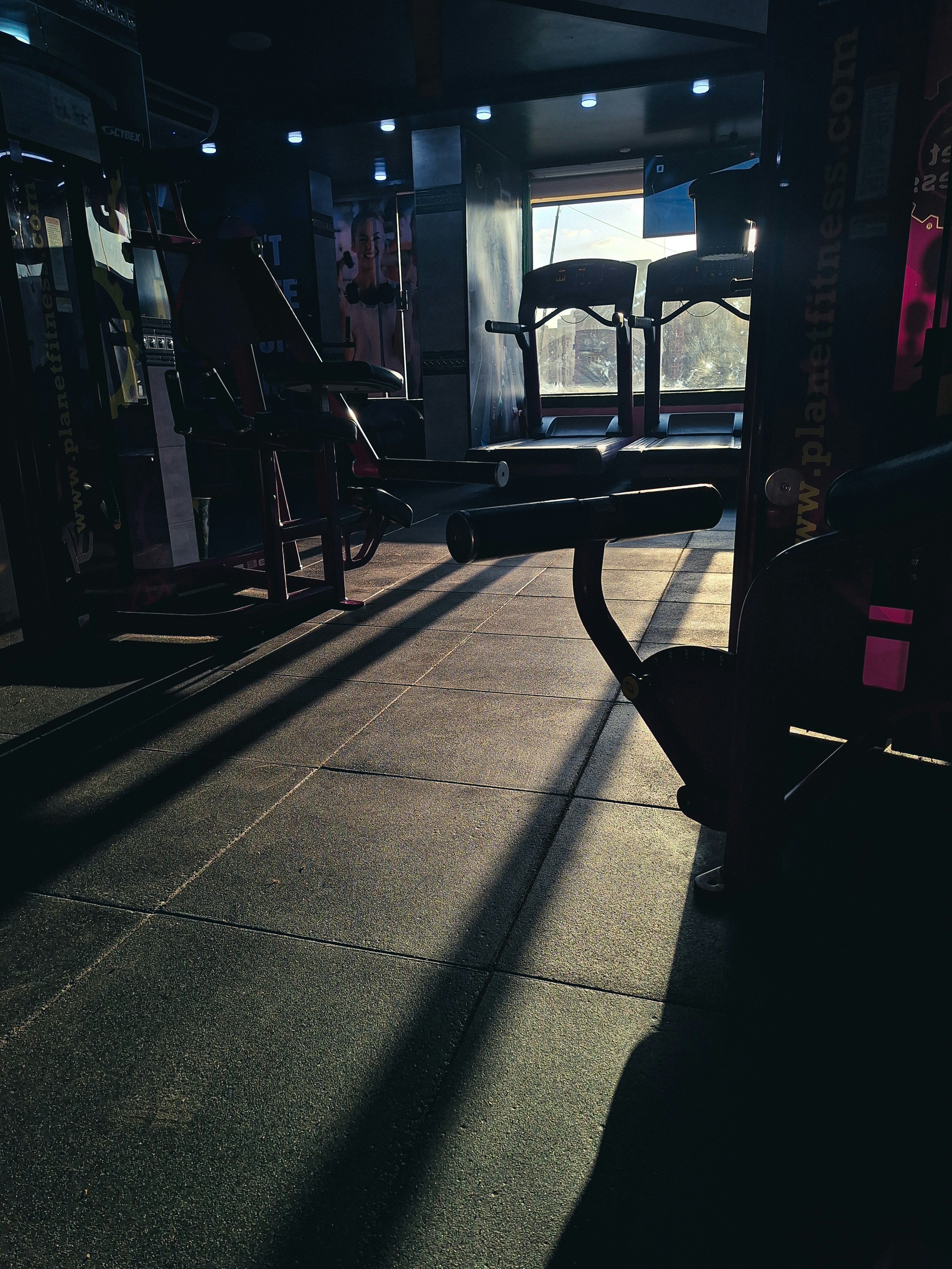 Rubber gym floor tiles in a commercial fitness room